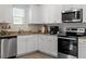 Well-equipped kitchen featuring granite countertops, stainless steel appliances, and ample cabinet space at 87 Royal Meadow Dr, Angier, NC 27501
