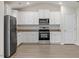 Well-lit kitchen featuring granite countertops, stainless steel appliances, and white cabinetry at 87 Royal Meadow Dr, Angier, NC 27501