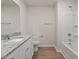 Bathroom featuring granite countertops, single vanity, and bath/shower combo at 94 Taverners Ln, Angier, NC 27501