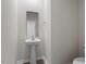 Bathroom with a pedestal sink, framed mirror, and grey paint at 94 Taverners Ln, Angier, NC 27501