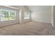 Spacious bedroom with carpet and two windows allowing natural light at 94 Taverners Ln, Angier, NC 27501