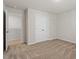 Carpeted bedroom with a closet and ensuite bathroom at 94 Taverners Ln, Angier, NC 27501