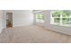 Bright bedroom with carpet, white walls, and large windows at 94 Taverners Ln, Angier, NC 27501