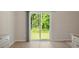Dining area with wood floors, a sliding glass door and lots of natural light at 94 Taverners Ln, Angier, NC 27501