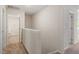 Hallway featuring neutral carpet, white trim, and several doorways at 94 Taverners Ln, Angier, NC 27501