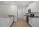 Kitchen with white cabinets, granite countertops, and stainless steel appliances at 94 Taverners Ln, Angier, NC 27501