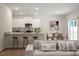 An open-concept kitchen and dining area featuring a breakfast bar and plenty of seating at 94 Taverners Ln, Angier, NC 27501