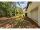 Large backyard with mature trees providing shade and privacy for the property at 944 Athens Dr, Raleigh, NC 27606