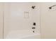 Bathroom showcasing a bathtub with white tile and a black showerhead at 944 Athens Dr, Raleigh, NC 27606