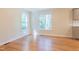 Bright dining room offering a view of the trees, hardwood floors, and light-colored walls at 944 Athens Dr, Raleigh, NC 27606