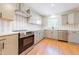 Bright, updated kitchen featuring stainless appliances, gray cabinetry, and stylish backsplash at 944 Athens Dr, Raleigh, NC 27606