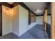 Covered front porch featuring brick and wood finishes, and inset lighting at 944 Athens Dr, Raleigh, NC 27606