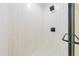 Stylish walk-in shower with white subway tile and modern black shower fixtures at 944 Athens Dr, Raleigh, NC 27606