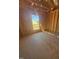Bedroom under construction with exposed wood frame, window view, and unfinished concrete floor at 95 Bald Cypress Ln, Youngsville, NC 27596