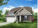 Charming exterior elevation with stone accents, gray siding, lush landscaping and inviting front porch at 95 Bald Cypress Ln, Youngsville, NC 27596