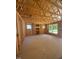 Living room under construction with exposed wood framing, a built-in, and window views at 95 Bald Cypress Ln, Youngsville, NC 27596