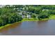 Panoramic aerial view of a lake community, showcasing the serene waterfront living and lush greenery at 9701 Corktree Ct, Wake Forest, NC 27587