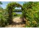 Garden path and floral archway overlooking the lake at 9701 Corktree Ct, Wake Forest, NC 27587