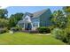 Lush lawn, expansive deck, hot tub, and screened porch offer relaxation and comfort at 9701 Corktree Ct, Wake Forest, NC 27587