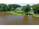 Serene backyard with lake views, complete with a dock and lush greenery at 9701 Corktree Ct, Wake Forest, NC 27587