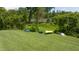 Backyard features kayaks and canoes by a lush landscape and access to the lake at 9701 Corktree Ct, Wake Forest, NC 27587