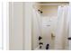 Shower and tub combo showcasing a shower with a clear curtain and black fixtures at 9701 Corktree Ct, Wake Forest, NC 27587