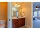 Bathroom featuring vanity with a decorative mirror, modern lighting, and a toilet at 9701 Corktree Ct, Wake Forest, NC 27587