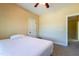 Bright bedroom showcasing a white bed, natural light, and a ceiling fan at 9701 Corktree Ct, Wake Forest, NC 27587