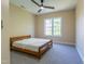 Bedroom featuring a wooden bed frame, natural light, and neutral carpet at 9701 Corktree Ct, Wake Forest, NC 27587