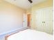 Bright bedroom features neutral walls, plush carpet, and closet for ample storage at 9701 Corktree Ct, Wake Forest, NC 27587