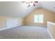 Bonus room with vaulted ceiling, recessed lighting, and a large window at 9701 Corktree Ct, Wake Forest, NC 27587