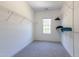 Walk-in closet with carpet floors and white wire shelving on either side of the walls at 9701 Corktree Ct, Wake Forest, NC 27587