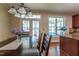 Formal dining room featuring hardwood floors, chandelier, and a view of the lake at 9701 Corktree Ct, Wake Forest, NC 27587