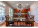 Dining area features wood table and chairs, and views of the kitchen and backyard at 9701 Corktree Ct, Wake Forest, NC 27587