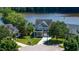 Inviting two-story home with a well-manicured lawn overlooking a beautiful lake at 9701 Corktree Ct, Wake Forest, NC 27587