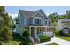 Charming two-story home with stone accents, a covered porch, and attached garage at 9701 Corktree Ct, Wake Forest, NC 27587