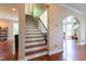 Sun-drenched foyer with gleaming hardwood and direct view into the home's living space at 9701 Corktree Ct, Wake Forest, NC 27587