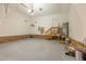 Spacious garage with epoxy floors, brick veneer, and ample storage space at 9701 Corktree Ct, Wake Forest, NC 27587
