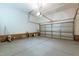 Spacious garage with epoxy floors, brick veneer, and ample storage space at 9701 Corktree Ct, Wake Forest, NC 27587