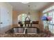 Kitchen island with granite countertop and double sink and a view into living room at 9701 Corktree Ct, Wake Forest, NC 27587