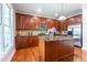 Spacious kitchen with wooden cabinets, granite countertops, and stainless steel refrigerator at 9701 Corktree Ct, Wake Forest, NC 27587