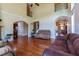 An expansive living area showcases high ceilings, hardwood floors, and natural light at 9701 Corktree Ct, Wake Forest, NC 27587