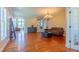 Spacious living room with hardwood floors, recessed lighting, and elegant chandelier at 9701 Corktree Ct, Wake Forest, NC 27587