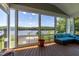 A beautiful screened-in porch offers stunning lake views and comfortable seating at 9701 Corktree Ct, Wake Forest, NC 27587