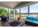 Relax on this screened porch with a stone fire pit and panoramic lake views at 9701 Corktree Ct, Wake Forest, NC 27587