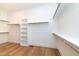 Organized walk-in closet featuring custom shelving, rods, and ample storage space for a well-curated wardrobe at 0 Bluestone Ct # 22 R, Chapel Hill, NC 27514