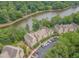 Aerial view of waterfront condos with dedicated parking and lush green landscaping at 0317 Glen Echo Ln # C, Cary, NC 27518