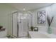 Walk-in shower with tiled surround and glass door featured in a bathroom at 0317 Glen Echo Ln # C, Cary, NC 27518