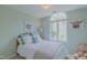 Comfortable bedroom with a large arched window, soft lighting, and soothing decor at 0317 Glen Echo Ln # C, Cary, NC 27518