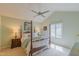 Spacious bedroom featuring a ceiling fan, ensuite bath, and a large window at 0317 Glen Echo Ln # C, Cary, NC 27518